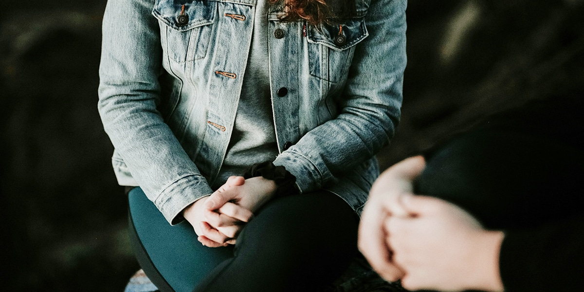 Two people talking with each other.