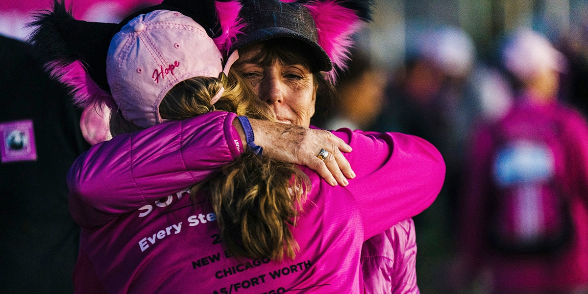 two strangers hugging