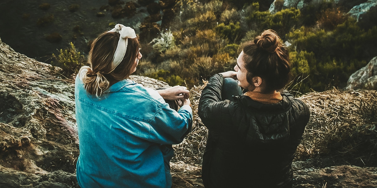 two woman listening to each other during a conversation