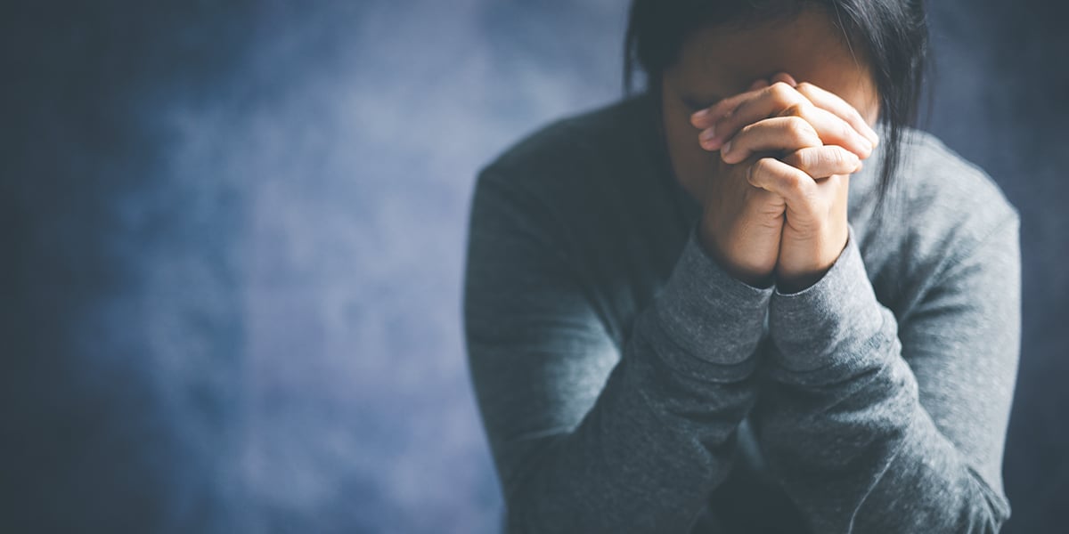 woman praying in pasture of humility