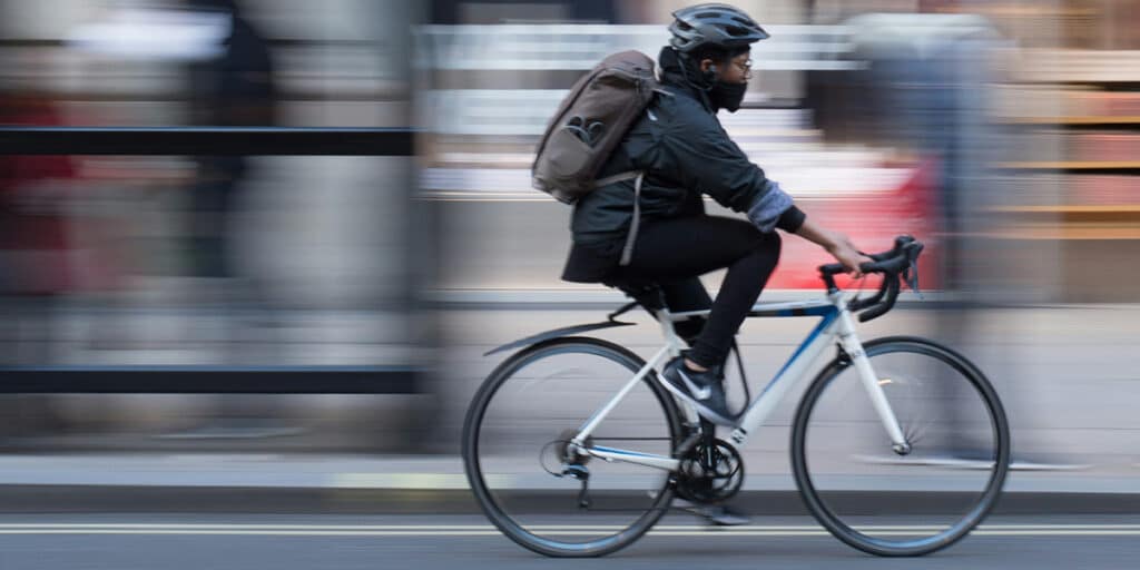 person riding a bike in the city,