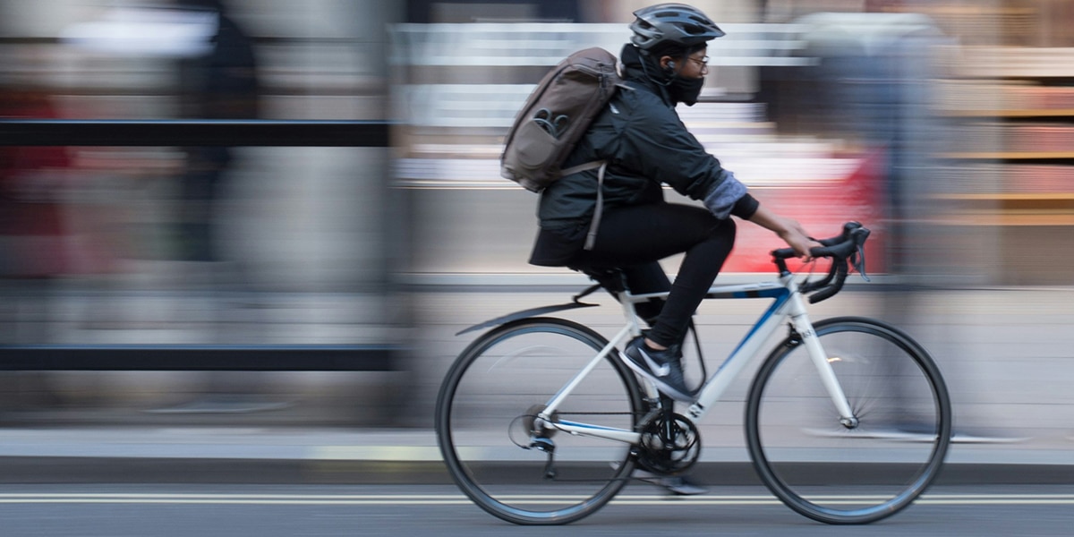 person riding a bike in the city,