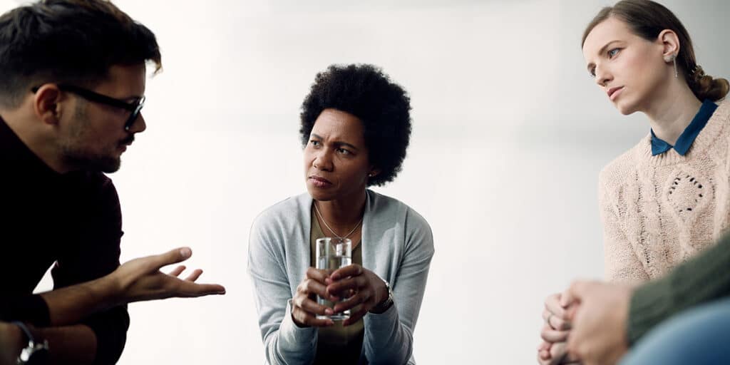 group of people in conversation and listening to each other