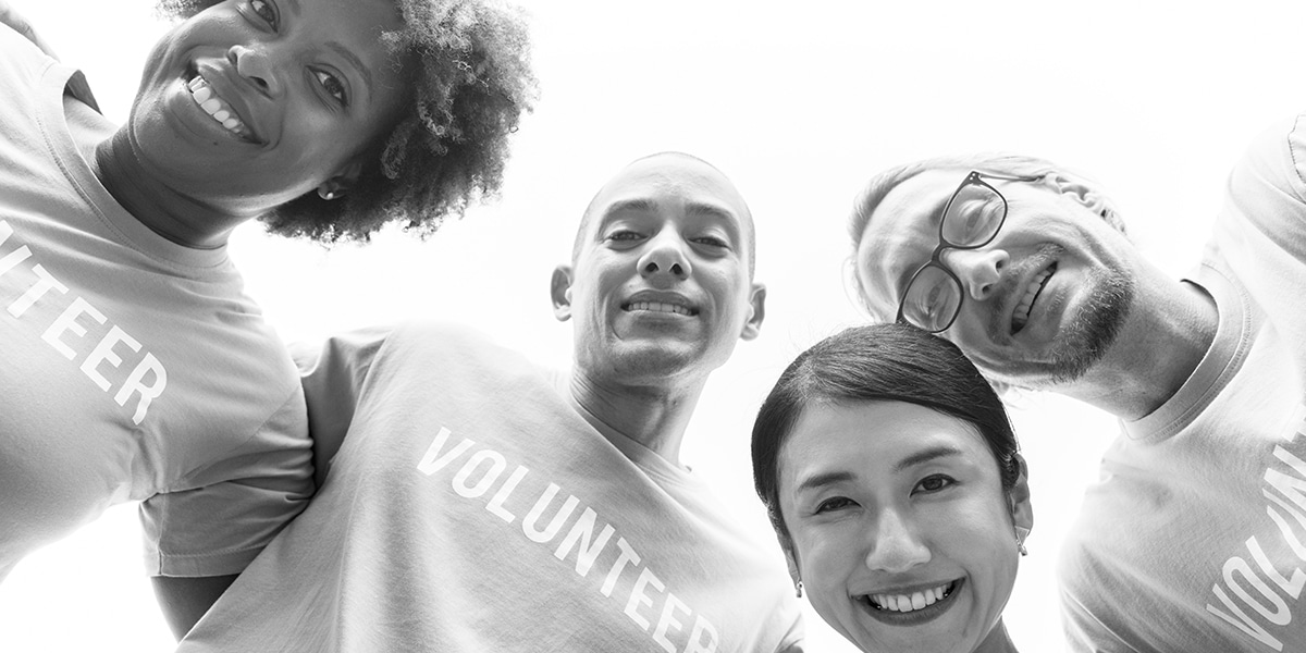 group of people wearing volunteer t-shirts