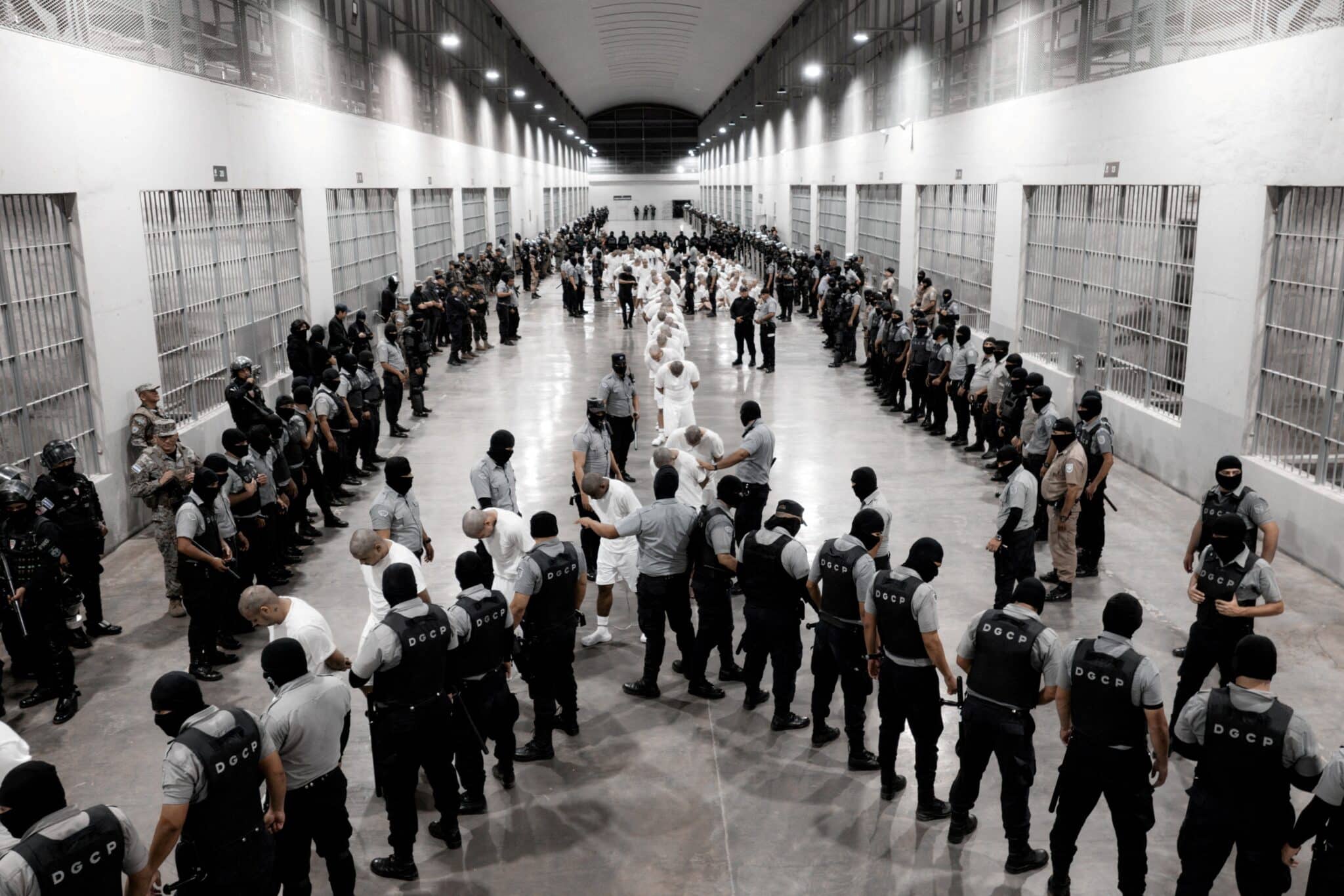 Salvadoran police officers escort an alleged member of the Venezuelan gang Tren de Aragua in Tecoluca, El Salvador, March 16, 2025, who were recently deported by the U.S. government to be imprisoned in the Terrorism Confinement Center (CECOT) prison, as part of an agreement with the Salvadoran government. (OSV News photo/Secretaria de Prensa de la Presidencia/Handout via Reuters)