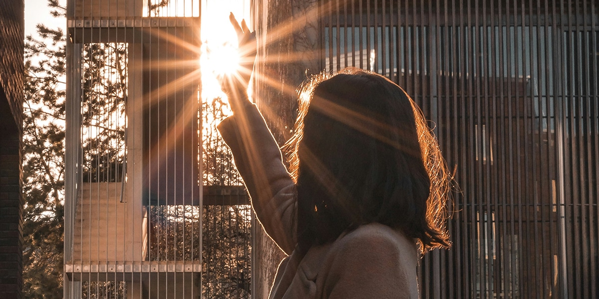 woman's hand reflected by sunlight