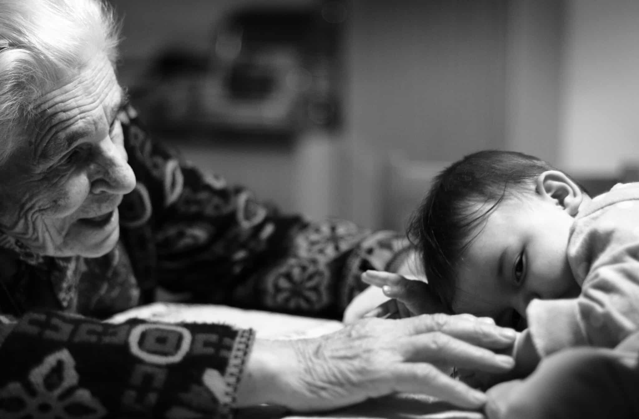 Woman comforts a baby | Photo by Paolo Bendandi on Unsplash