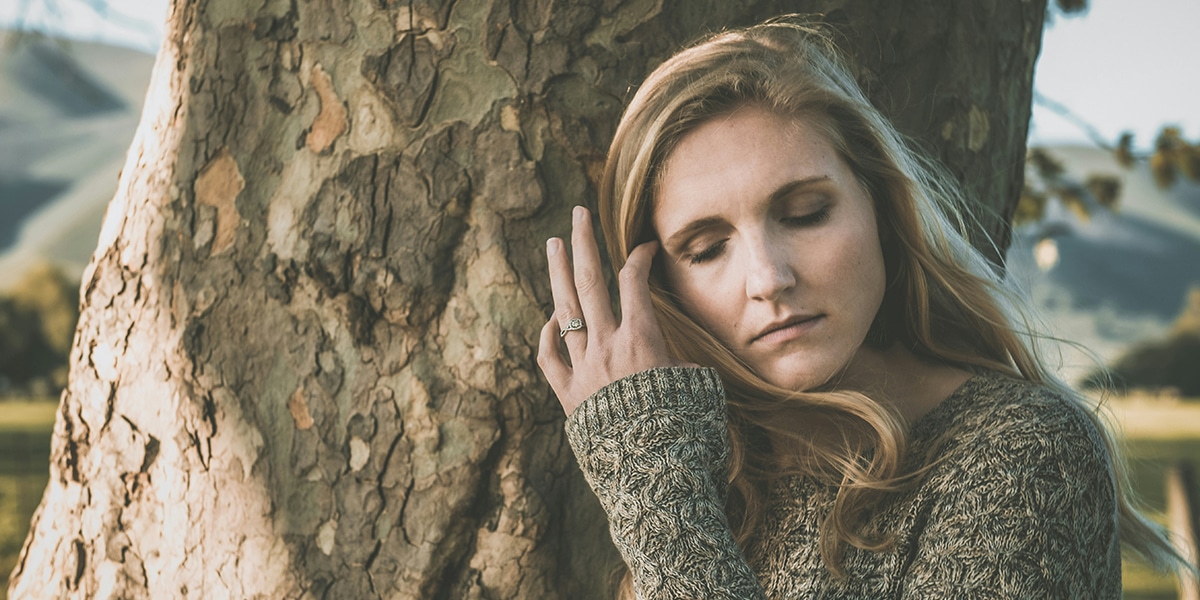 woman with a painful, sad facial expression